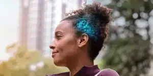 A woman taking a walk in the park. Her brain is highlighted as if to show enhanced activity.