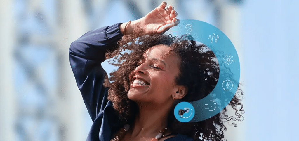 A woman enjoying being able to hear with the Oticon Zeal hearing aid.
